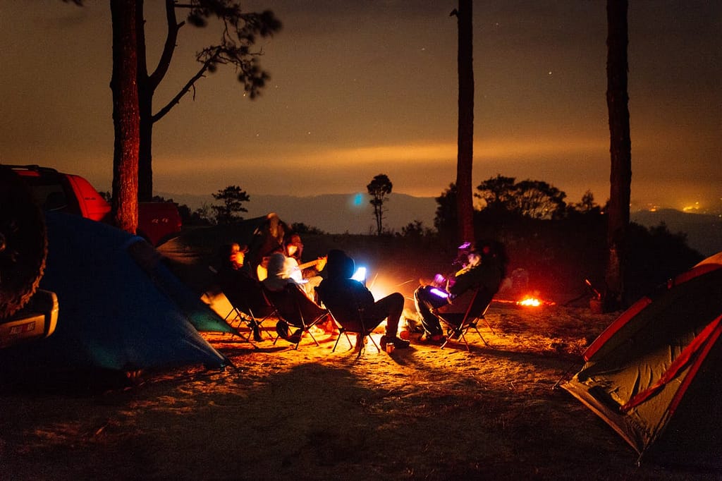 8 Essential Tips for Choosing the Right Tent: Your Complete Camping Buyer’s Guide Group of campers sitting near their tent enjoying sunset view